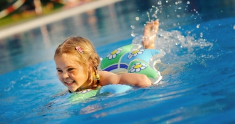 child playing in the pool at woodcreek