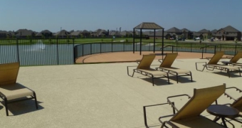 Woodcreek Lakeside Amenity deck with lounge chairs looking out to lake